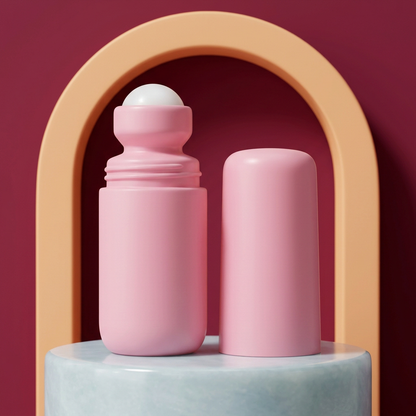 Pink roll-on serum on ice blue pedestal with apricot and berry backdrop